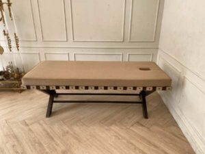 Spa massage bed, wooden legs, brown fabric cushion