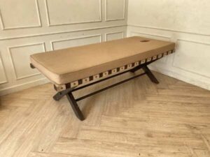 Spa massage bed, wooden legs, brown fabric cushion