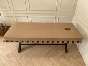 Spa massage bed, wooden legs, brown fabric cushion