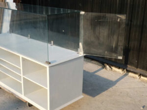Product shelves, shelves with glass cabinet shelves, white wooden frame.