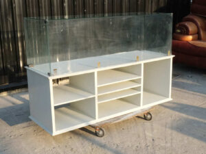 Product shelves, shelves with glass cabinet shelves, white wooden frame.