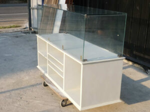 Product shelves, shelves with glass cabinet shelves, white wooden frame.