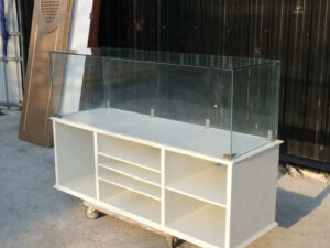Product shelves, shelves with glass cabinet shelves, white wooden frame.