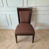 Wooden chair, brown fabric cushion, beautiful frame, cushioned backrest.