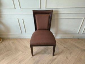 Wooden chair, brown fabric cushion, beautiful frame, cushioned backrest.