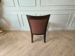 Wooden chair, brown fabric cushion, beautiful frame, cushioned backrest.