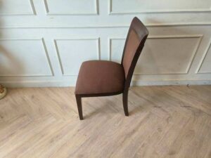 Wooden chair, brown fabric cushion, beautiful frame, cushioned backrest.