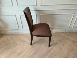 Wooden chair, brown fabric cushion, beautiful frame, cushioned backrest.