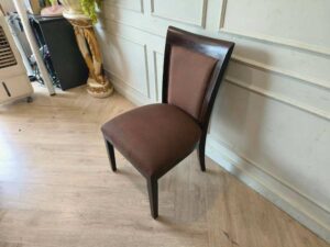 Wooden chair, brown fabric cushion, beautiful frame, cushioned backrest.
