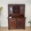 Wooden display cabinet in the hall, antique style, walnut color, European work from Germany.