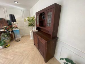 Wooden display cabinet in the hall, antique style, walnut color, European work from Germany.