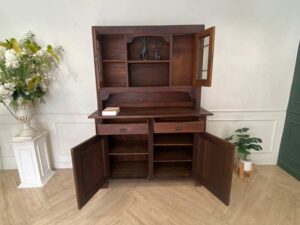 Wooden display cabinet in the hall, antique style, walnut color, European work from Germany.