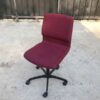 Office chair, red fabric cushion, Modernform brand.