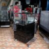 Jewelry cabinet, glass cabinet to display products Square shape, 1 glass door opening, black wooden base.