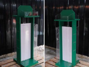 Tall product holder Product display box, 2 sides, green wooden frame. Attached to clear acrylic