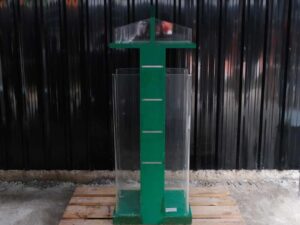 Tall product holder Product display box, 2 sides, green wooden frame. Attached to clear acrylic