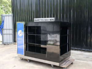 Product shelves, 4 sides, with curtains that can be opened and closed, product labels on 2 sides, wooden frame covered with black high-gloss surface.