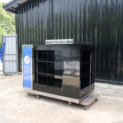 Product shelves, 4 sides, with curtains that can be opened and closed, product labels on 2 sides, wooden frame covered with black high-gloss surface.