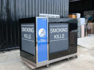 Product shelves, 4 sides, with curtains that can be opened and closed, product labels on 2 sides, wooden frame covered with black high-gloss surface.