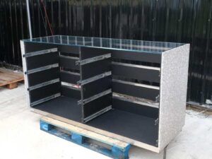 Large counter, 180 cm glass top, left-right marble walls. Wooden base, stainless steel edge