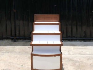 4 wooden product shelves (brown-white) with storage cabinets at the back.