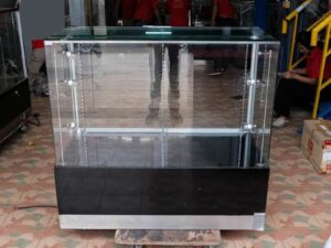 Jewelry cabinet, glass cabinet to display products Rectangular shape, tall mirror, sliding glass door. Wooden base, stainless steel edge