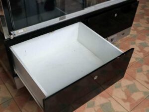 Jewelry cabinet, glass cabinet to display products Rectangular shape, tall mirror, sliding glass door. Wooden base, stainless steel edge