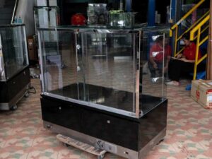 Jewelry cabinet, glass cabinet to display products Rectangular shape, tall mirror, sliding glass door. Wooden base, stainless steel edge