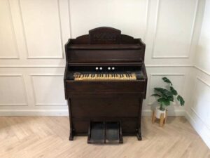 Antique piano, walnut color, European made from Germany.