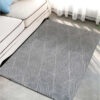 Fur carpet for the living room, gray color, triangle pattern
