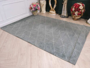Fur carpet for the living room, gray color, triangle pattern