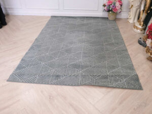 Fur carpet for the living room, gray color, triangle pattern
