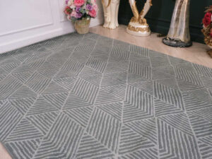 Fur carpet for the living room, gray color, triangle pattern