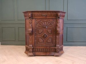 Carved wooden corner cabinet with 1 door that opens. European work from Germany.
