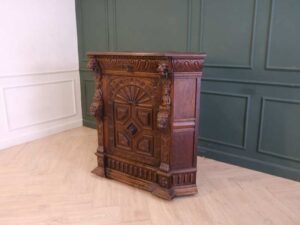 Carved wooden corner cabinet with 1 door that opens. European work from Germany.