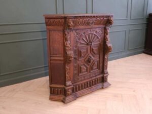 Carved wooden corner cabinet with 1 door that opens. European work from Germany.