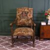 Carved chair, Louis style, fabric cushion with men's floral pattern. European work comes from Germany.