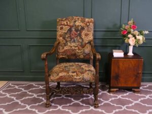Carved chair, Louis style, fabric cushion with men's floral pattern. European work comes from Germany.