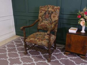 Carved chair, Louis style, fabric cushion with men's floral pattern. European work comes from Germany.