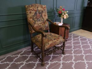 Carved chair, Louis style, fabric cushion with men's floral pattern. European work comes from Germany.