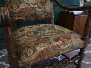 Carved chair, Louis style, fabric cushion with men's floral pattern. European work comes from Germany.