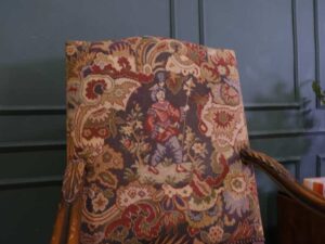 Carved chair, Louis style, fabric cushion with men's floral pattern. European work comes from Germany.