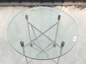 Round glass top table, cut glass, steel legs, hotel grade work.