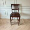 Wooden chair, brown dining chair, beautiful design, slightly curved backrest.