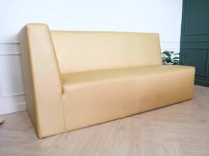 Three-seater leather sofa, beautiful shade, wooden frame, golden yellow color.