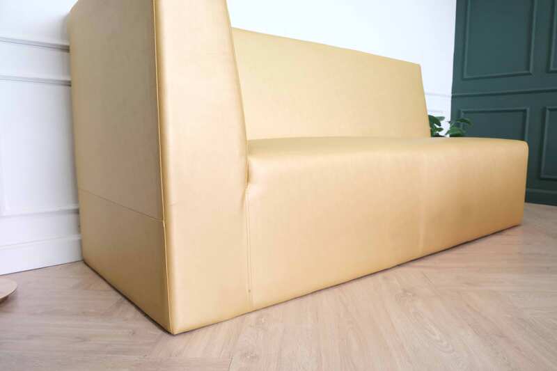 Three-seater leather sofa, beautiful shade, wooden frame, golden yellow color.