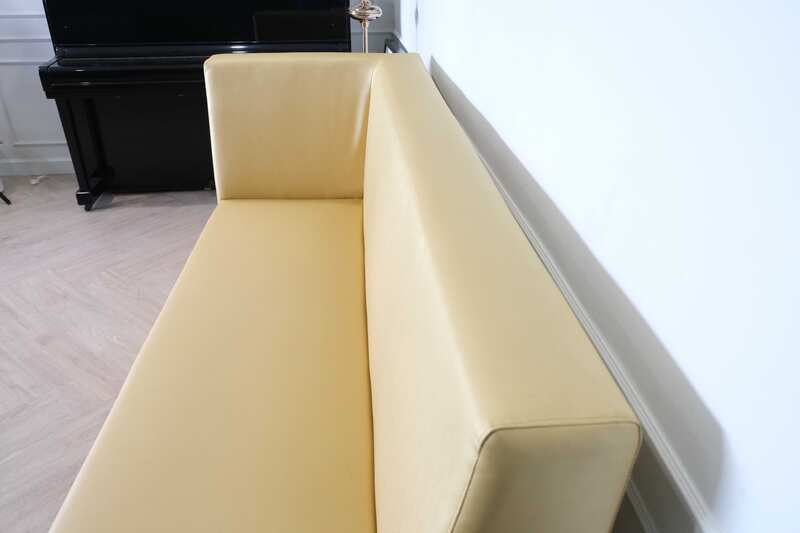 Three-seater leather sofa, beautiful shade, wooden frame, golden yellow color.