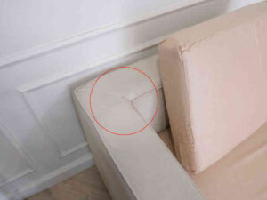 L-shaped sofa, 3-seater sofa, thick cream-pink fabric seats, wooden frame.