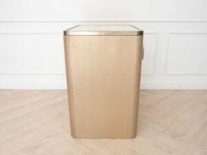 Wooden cabinet, 1 door, square shape Modern, luxury style, brown with gold stainless steel edges.
