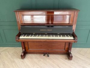 Hornung & Moller grand piano, made in Germany, plays normally on all keys.